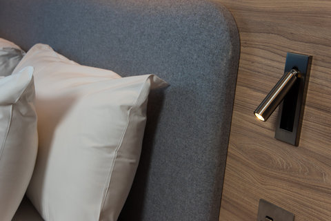 Nifty reading lights and USB ports by your bedside