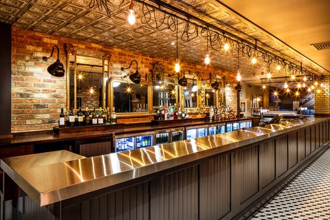 Elegant T6 bar with feature lighting and premium drinks display