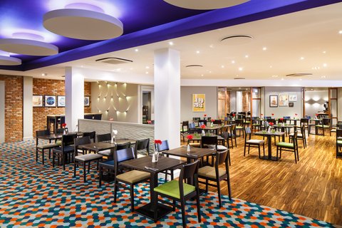 Contemporary restaurant with seating and bright open layout