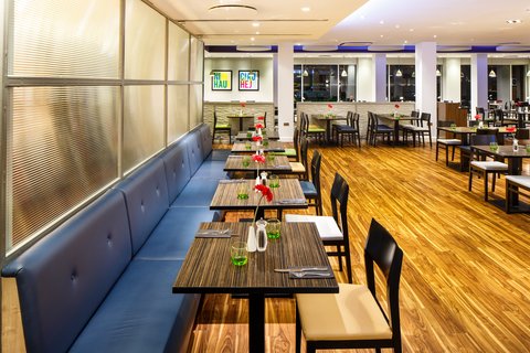 Spacious restaurant with booth seating, perfect for a family meal