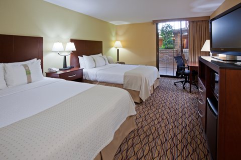 Families love our well-appointed Queen/Queen pool side guest room.