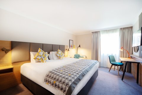 Enjoy a large bed in our Reading hotel room