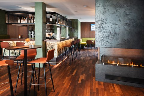 Cozy Bar with fireplace at Holiday Inn Innsbruck