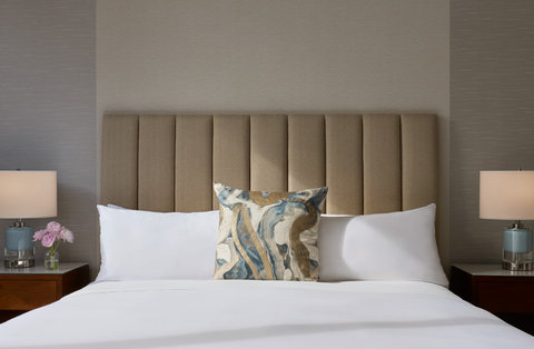 Bedroom close-up with pillows and headboard.