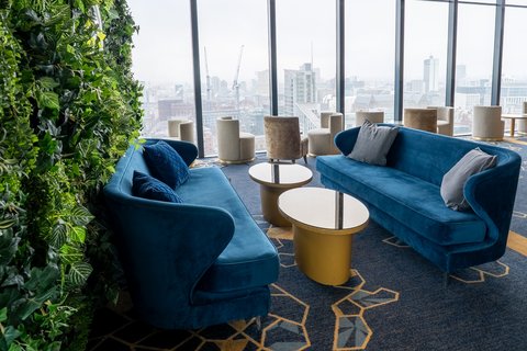 Lounge with scenic views of Manchester, ideal for a date or event.