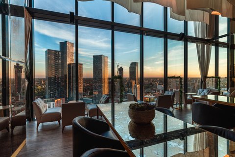Dine with panoramic city views in our refined restaurant