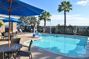 thumbnail: Take a dip in our heated, outdoor swimming pool.