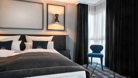 Stay in our elegant premium room with a comfy queen bed