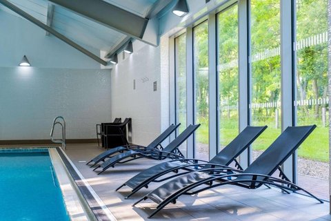 Relax beside the pool on loungers.