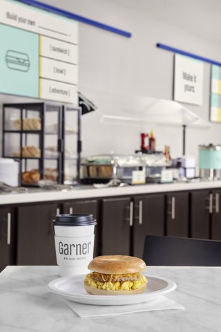 Start your day right with a breakfast sandwich and coffee.
