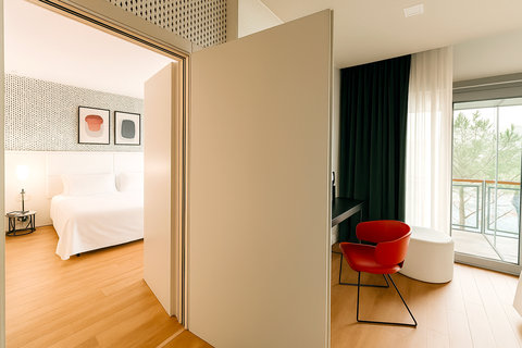 Room with two single beds connecting with another double bedroo
