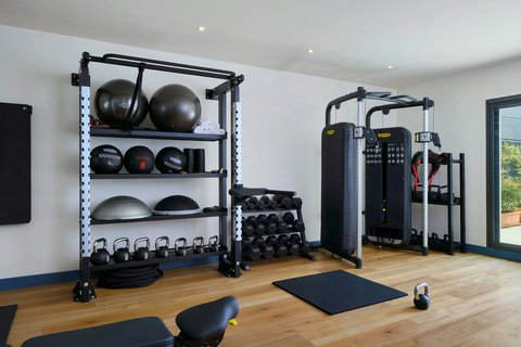 Weights and training stations in the gym.