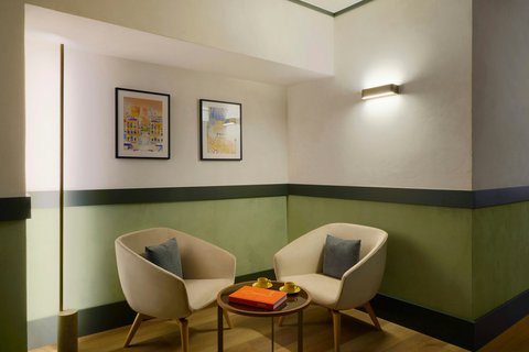 Armchairs and artwork in the Executive Room.