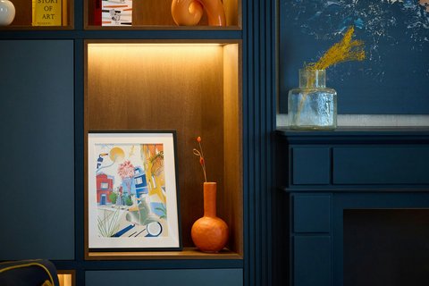 Lobby detail with artwork and blue wall.