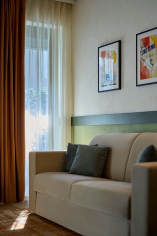 Soft bedroom detail in the Milano Suite.
