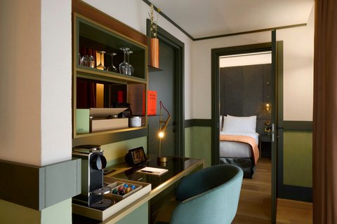 Suite interior with warm residential styling.